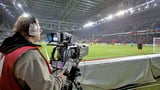 Cameraman pitch side with camera